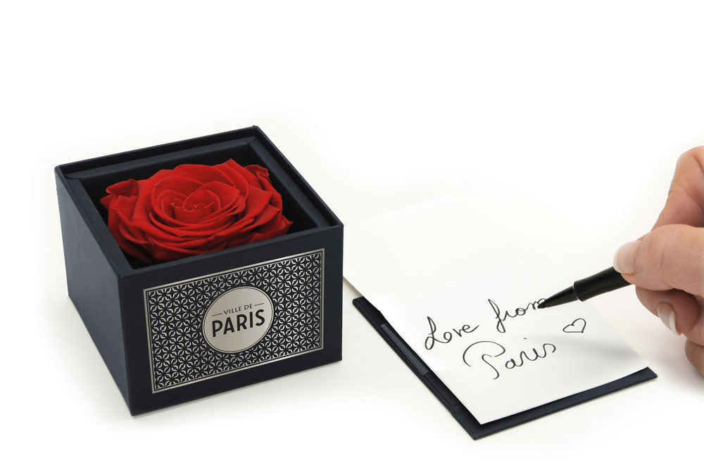 Introducing our exquisite Ville de Paris Black Box with Leather Effect, housing a stunning red eternity rose. This luxurious presentation features a removable lid and a two-fold message card for that personal touch. The front proudly displays the iconic Eiffel Tower, while the back provides a blank canvas for your heartfelt message.