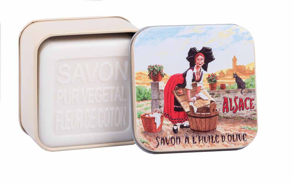 Step back in time with La Savonnerie de Nyons' Cotton Flower Soap, presented in a vintage 'L'Alsacienne' tin, depicting a traditional Alsatian scene, perfect for lovers of French heritage and natural skincare.