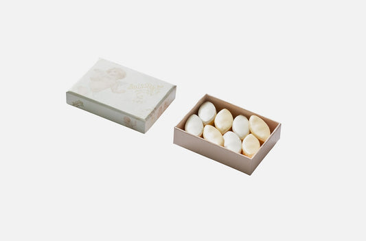 The Maison Boissier Pink and White Calisson Angel Box is a luxurious gift box filled with delicious pink and white calissons. These traditional French sweets are made from a blend of ground almonds, candied melon, and a layer of royal icing.